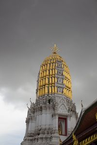 Low angle view of statue of building against sky