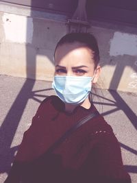 Portrait of young woman standing outdoors