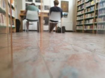 Rear view of people sitting on chair