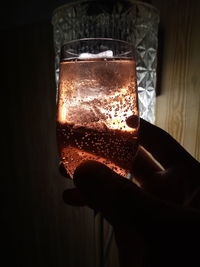 Close-up of hand holding glass of wine