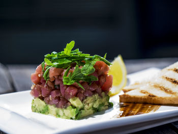 Close-up of tuna tartare with avocados served in plate
