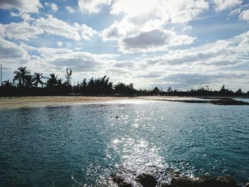 Scenic view of sea against cloudy sky