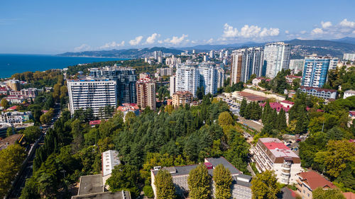 High angle view of trees and buildings against sky