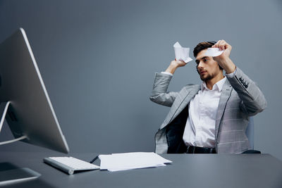 Tired businessman at desk in office