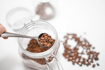 High angle view of drink in jar against white background