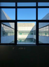 Reflection of building on glass window