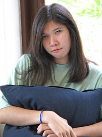 Portrait of beautiful woman sitting at home