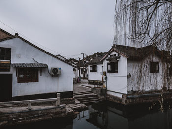 Houses against sky in city