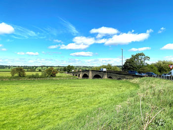 View of the old stone bridge, spanning the river wharfe in, pool, otley, yorkshire, uk