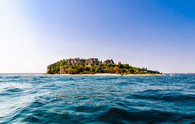 Scenic view of sea against clear blue sky