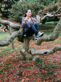 Full length of woman standing in park