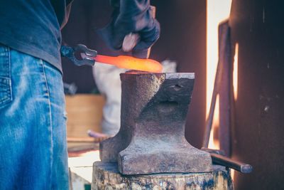 Midsection of man working