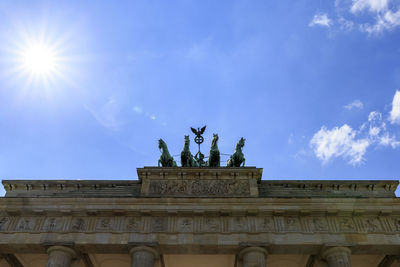 Low angle view of statue against blue sky