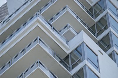 Abstract angles are seen from a low angle of the balconies of a high rise building