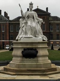 Low angle view of statue against building