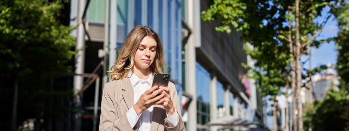 Young woman using mobile phone