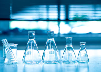 Close-up of laboratory glassware on table