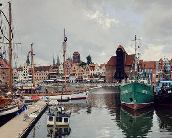 Boats moored at harbor