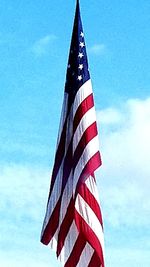 Low angle view of flag against sky