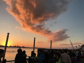 People at observation point against sky