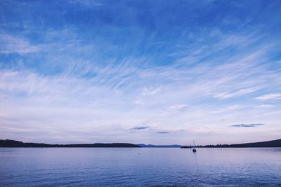 View of calm sea against cloudy sky