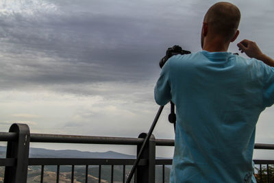 Man overlooking countryside landscape