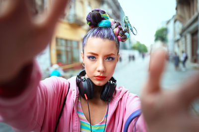 Portrait of beautiful woman on road in city