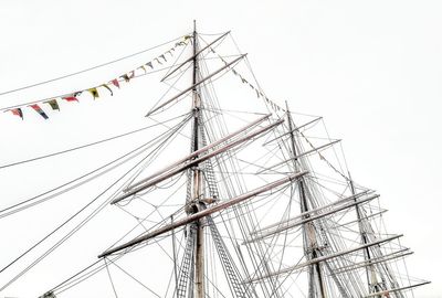 Low angle view of sailboat against clear sky