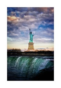 Statue of liberty against cloudy sky