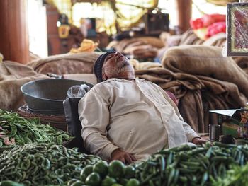 A man sitting at the market..street photography 