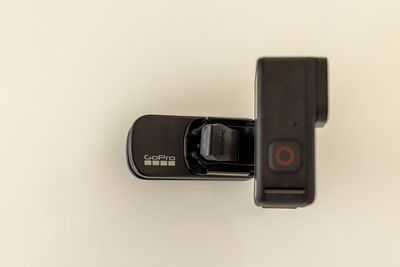 Close-up of camera phone against white background