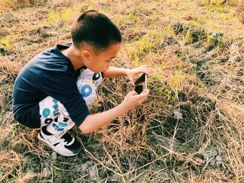 Boy playing on field