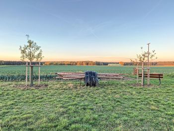 Scenic view of field against sky during sunset