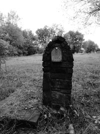 Old ruin on field against sky