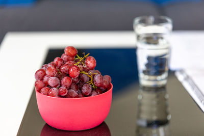 Close-up of fruits in glass bowl on table