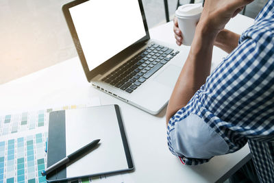 High angle view of businessman working at desk in office