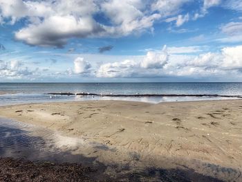 Scenic view of beach against sky