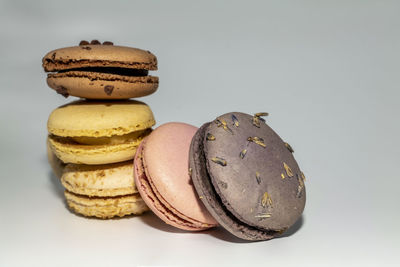 Close-up of macaroons against white background