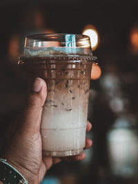 Close-up of hand holding drink