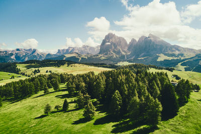 Scenic view of landscape and mountains against sky
