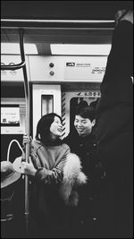 Portrait of happy woman in train