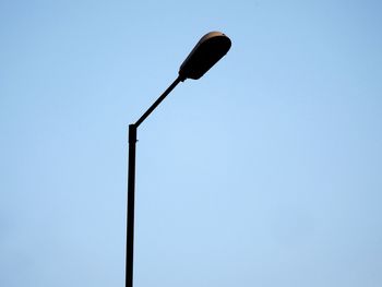 Low angle view of street light against clear sky