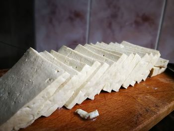 Close-up of tofu on cutting board