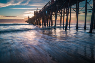 Scenic view of sea against sky at sunset