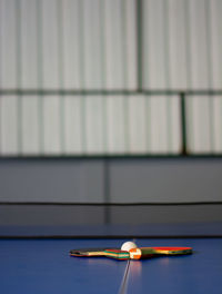 Close-up of ball on table against wall