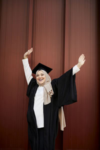 Smiling woman wearing graduation hat