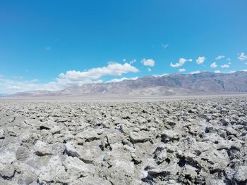 Scenic view of mountains against cloudy sky