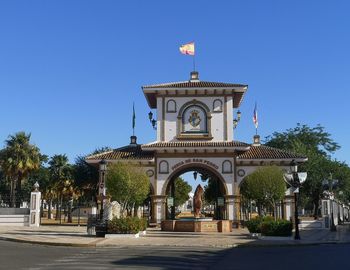 Low angle view of church against clear blue sky