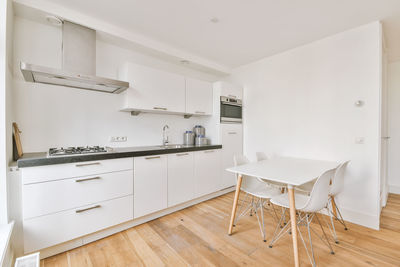 Empty chairs and table in bathroom