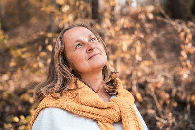 Portrait of woman in forest during autumn